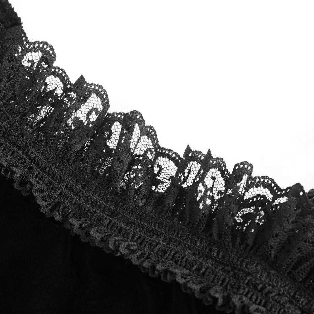 Close-up of intricate black lace detailing on an off-the-shoulder top, showcasing a romantic and gothic style.