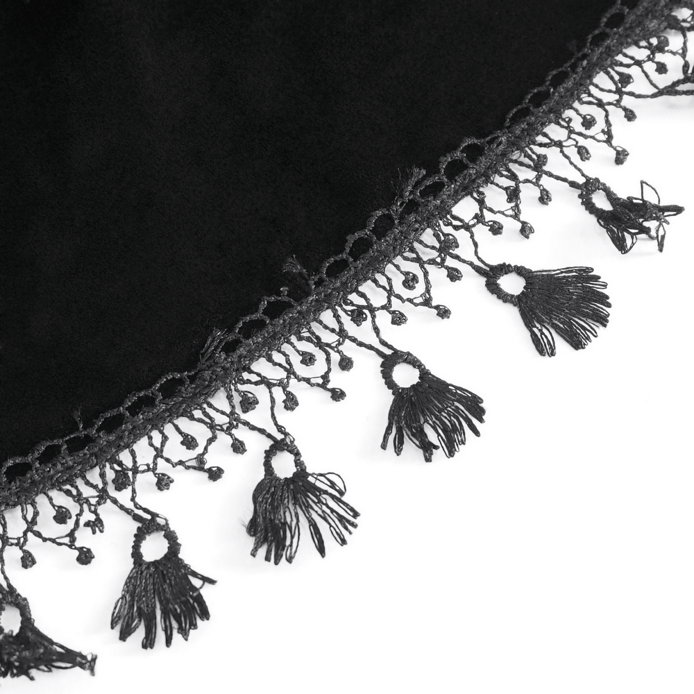 Close-up of black lace fringe detail, showcasing intricate tassels and a delicate crochet trim for a dramatic touch.
