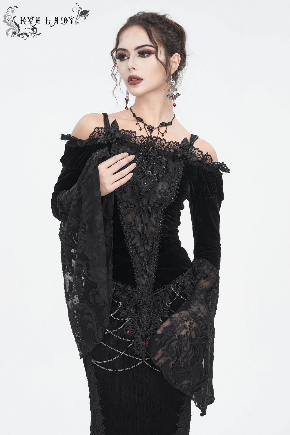 Chic off-the-shoulder black lace top with bell sleeves, perfect for a gothic-inspired night out.