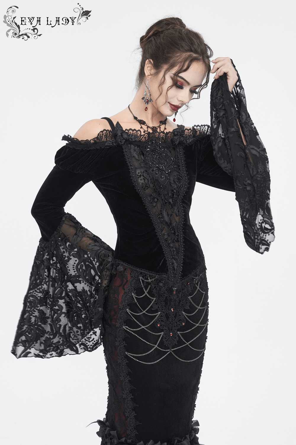 Chic off-the-shoulder black lace top with long bell sleeves, showcasing gothic romance and a sheer peek-a-boo effect.