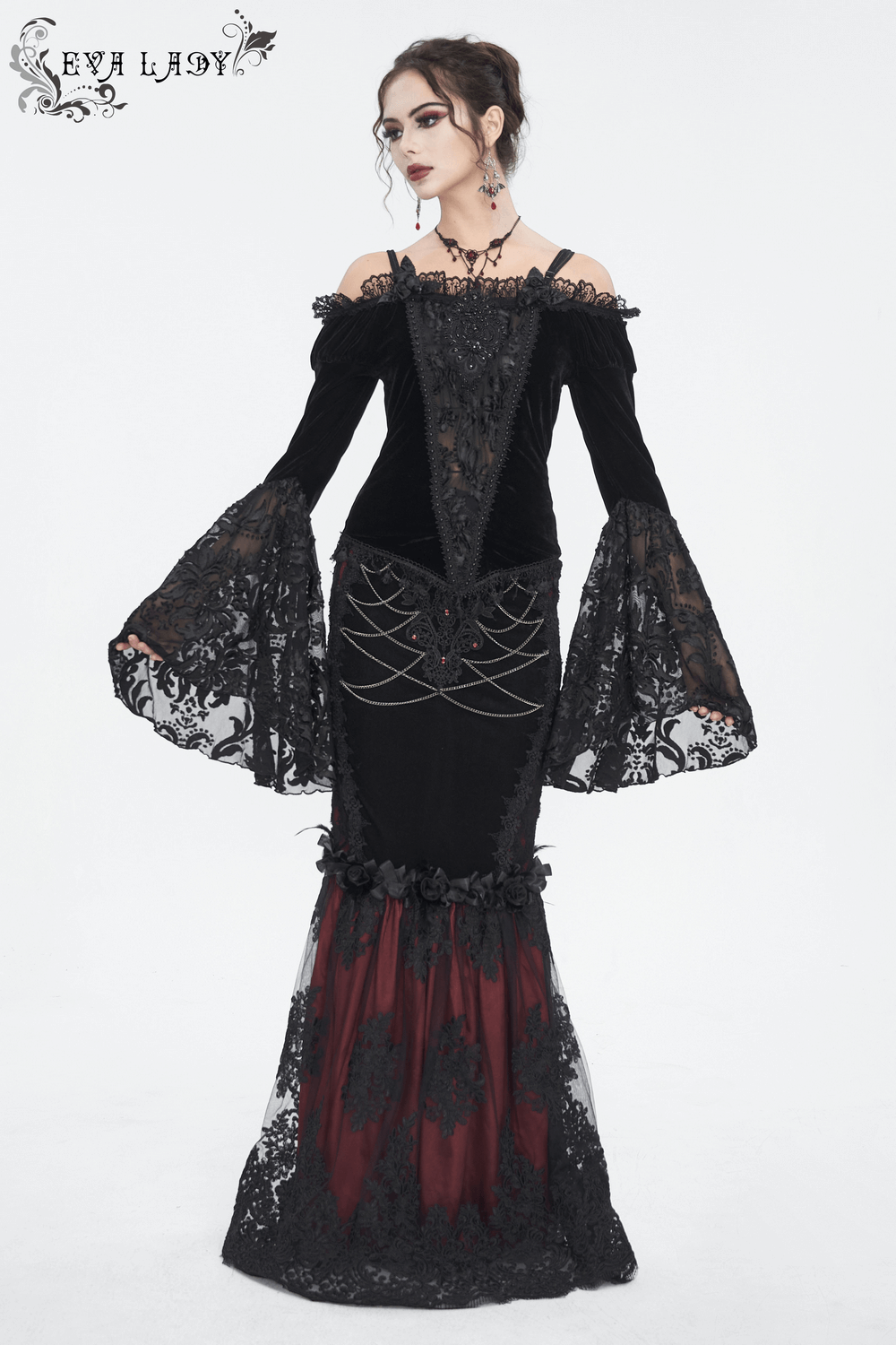 Chic black off-the-shoulder lace top with bell sleeves and fringe, embodying gothic romance and elegance.