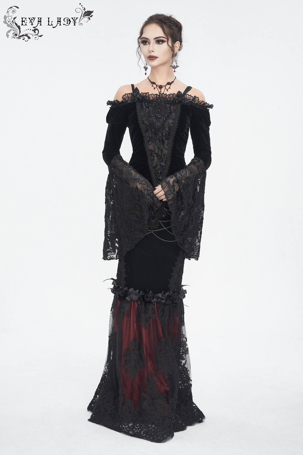 Chic off-the-shoulder black lace top with bell sleeves and fringe, embodying gothic elegance and romance.