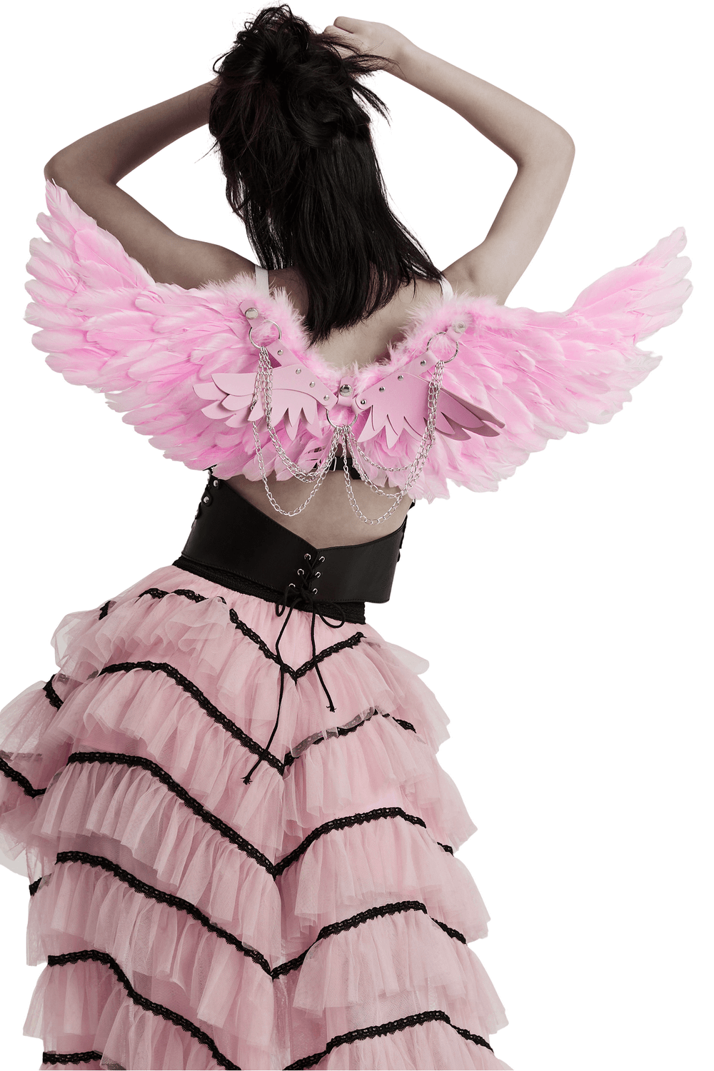 Model showcasing chic pink feathered angel wings harness with silver chains, perfect for festivals and events.