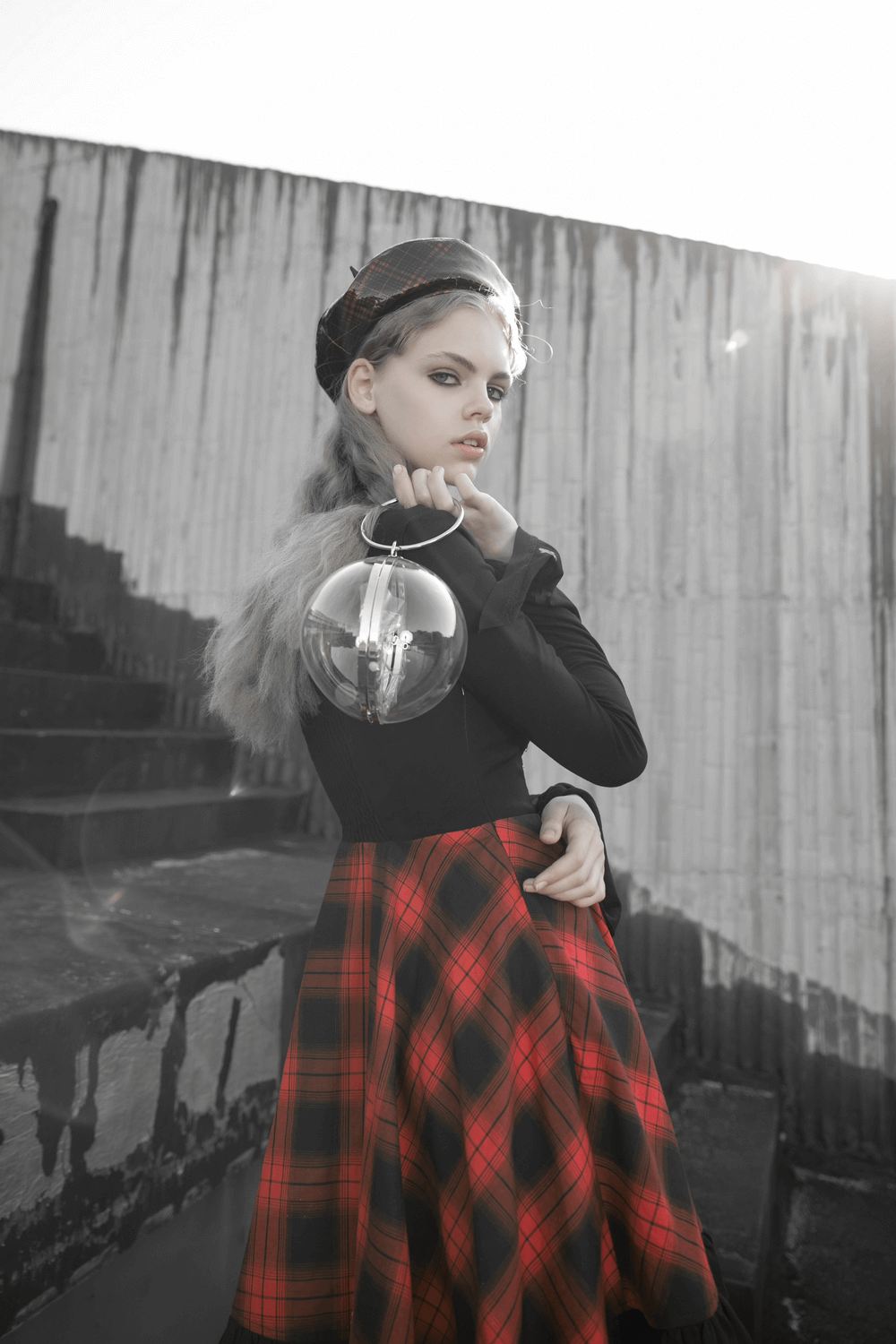 Chic Plaid A-Line Dress with lace trim and unique waist detail, model posing stylishly with a circular handbag.