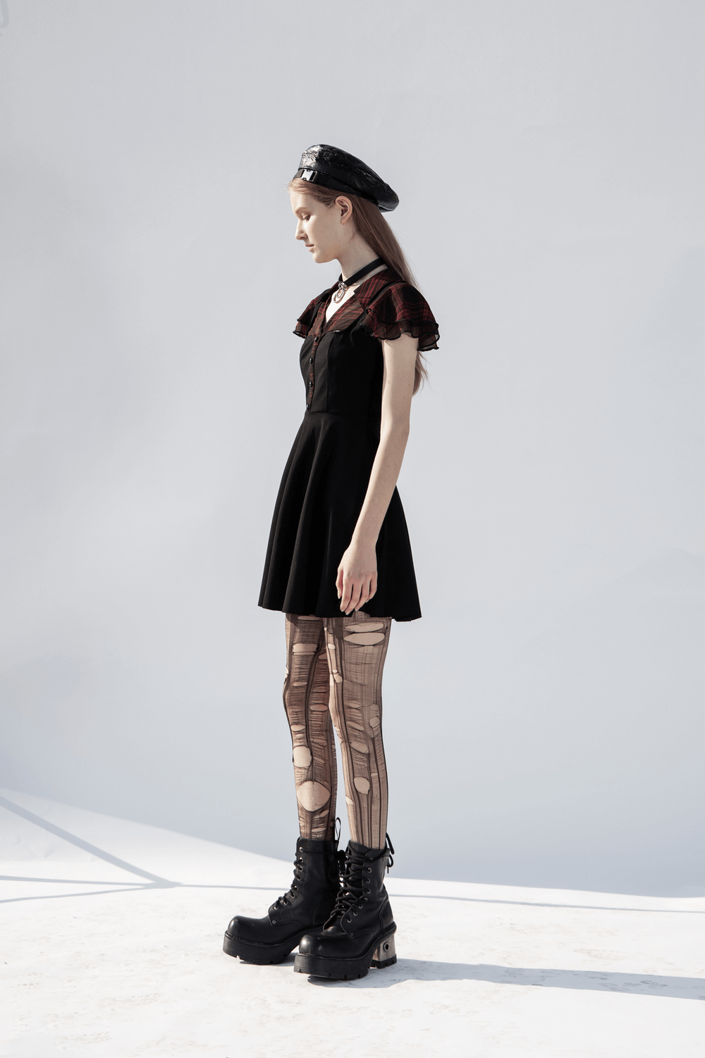 Chic Gothic A-Line dress with ruffled sleeves, V-neck, and bold black combat boots, showcasing a unique and stylish silhouette.