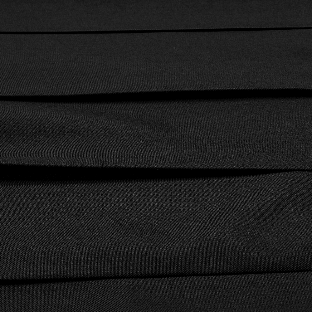 Close-up of black pleated fabric showcasing texture and style for a punk-inspired half skirt.