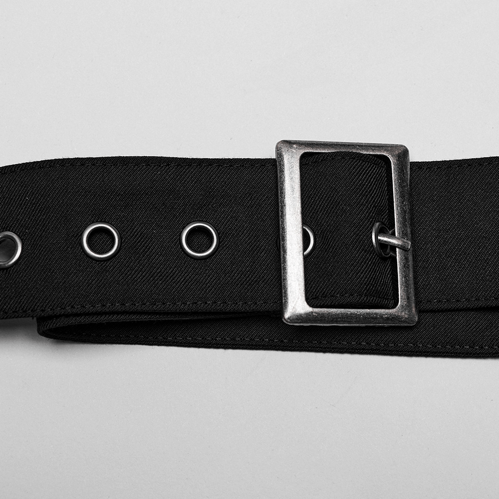 Black punk-style belt with silver buckle and grommet details for edgy fashion looks.