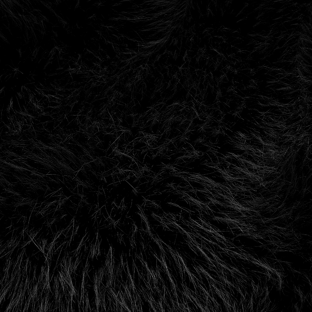 Close-up of soft black faux fur fabric, perfect for chic punk fashion jackets and edgy style.