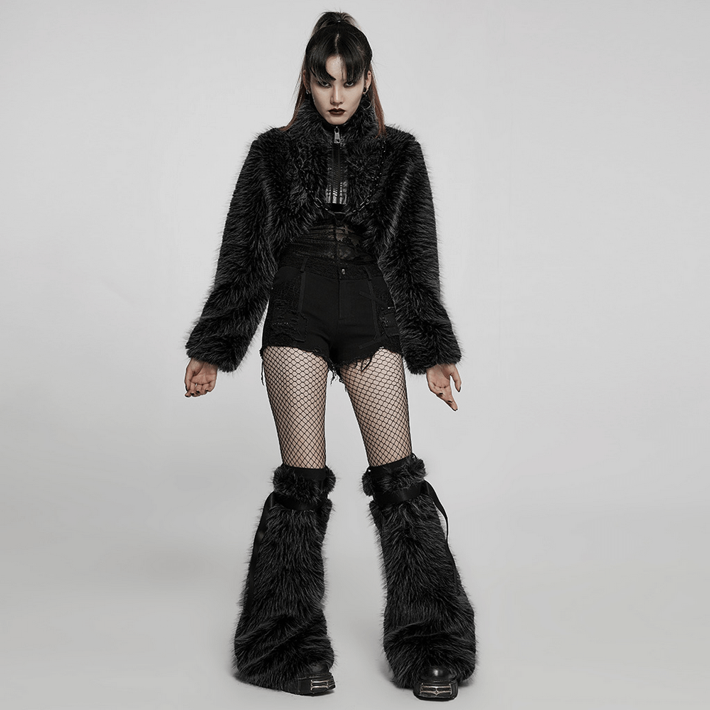 Chic punk model in a black faux fur zippered crop jacket, embodying edgy style with striking fishnet stockings and flared pants.