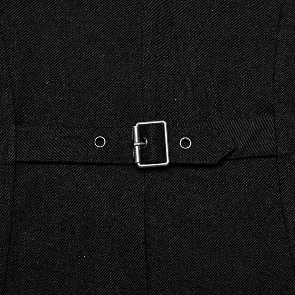Close-up of a black punk-inspired vest's metal buckle and strap detail, showcasing edgy fashion design.