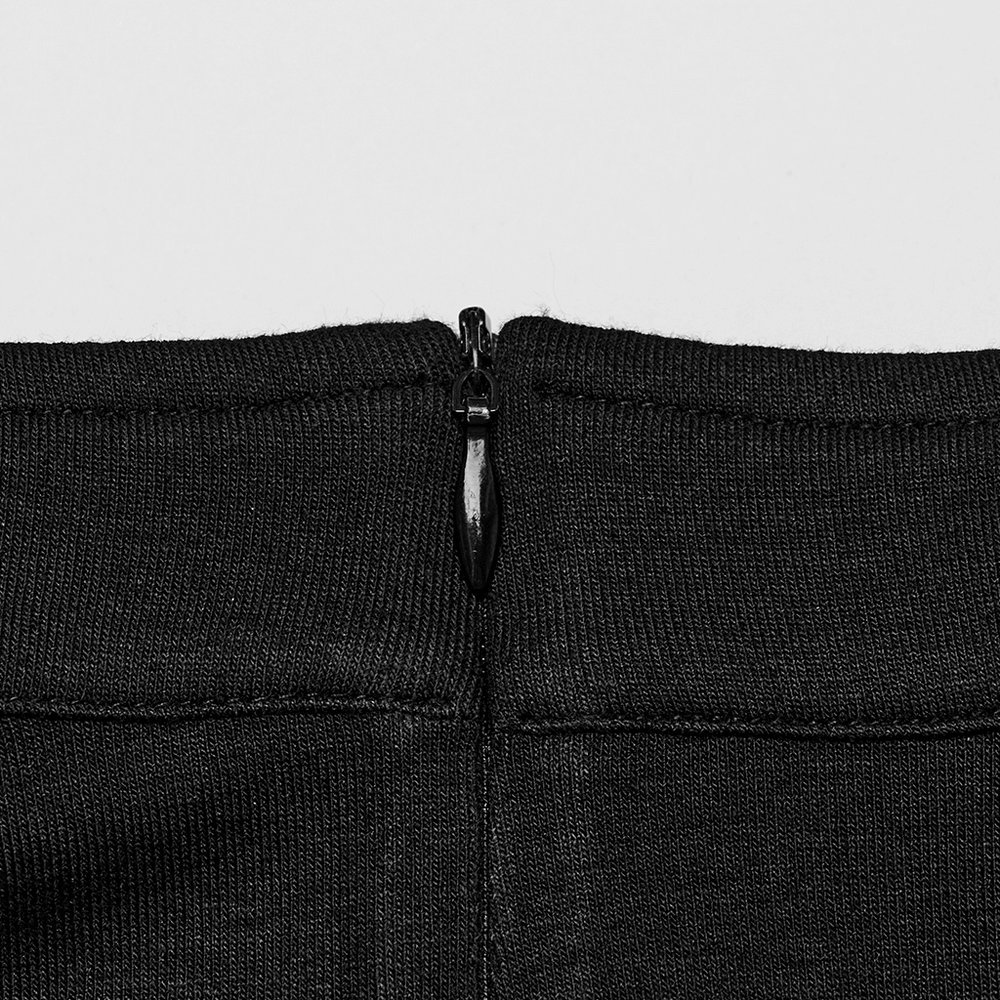 Close-up of a chic black crop top showcasing a zipper detail at the back for a stylish finish.