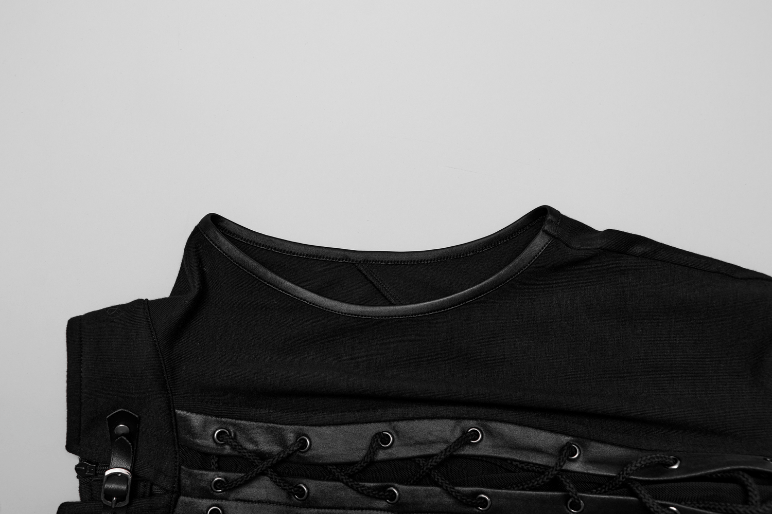 Chic punk lace-up crop top featuring mesh splice and buckle detail on a sleek black fabric.