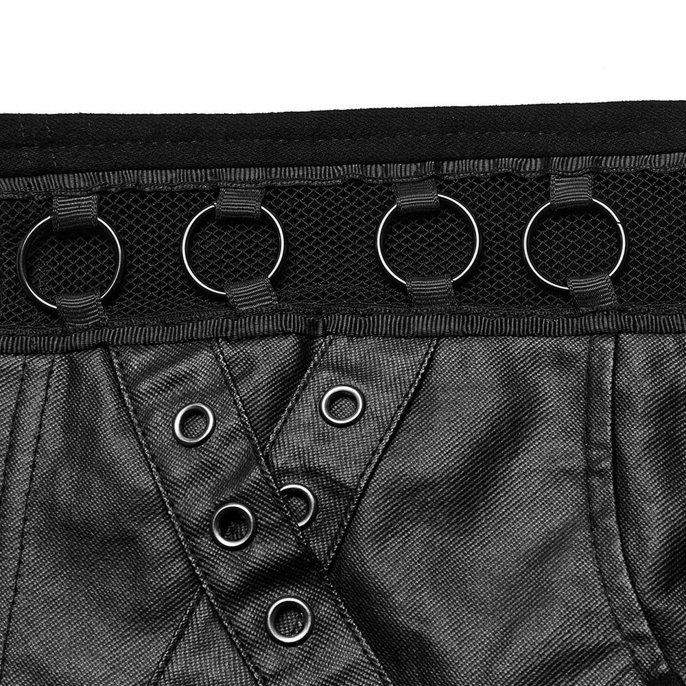Close-up of chic punk black denim shorts featuring eyelet details and metal ring embellishments.