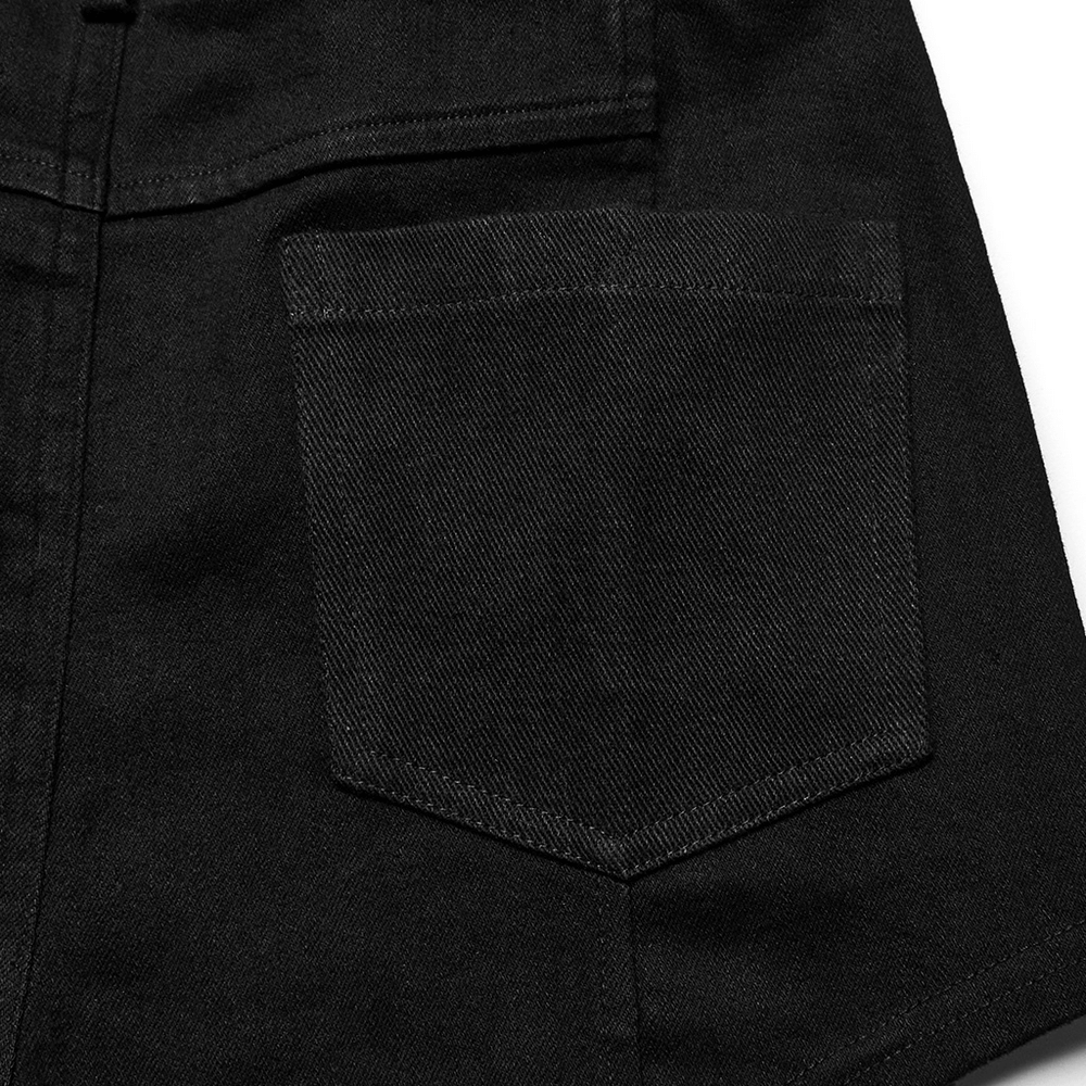 Close-up of a back pocket on chic punk rivet-embellished black denim shorts showcasing edgy design.