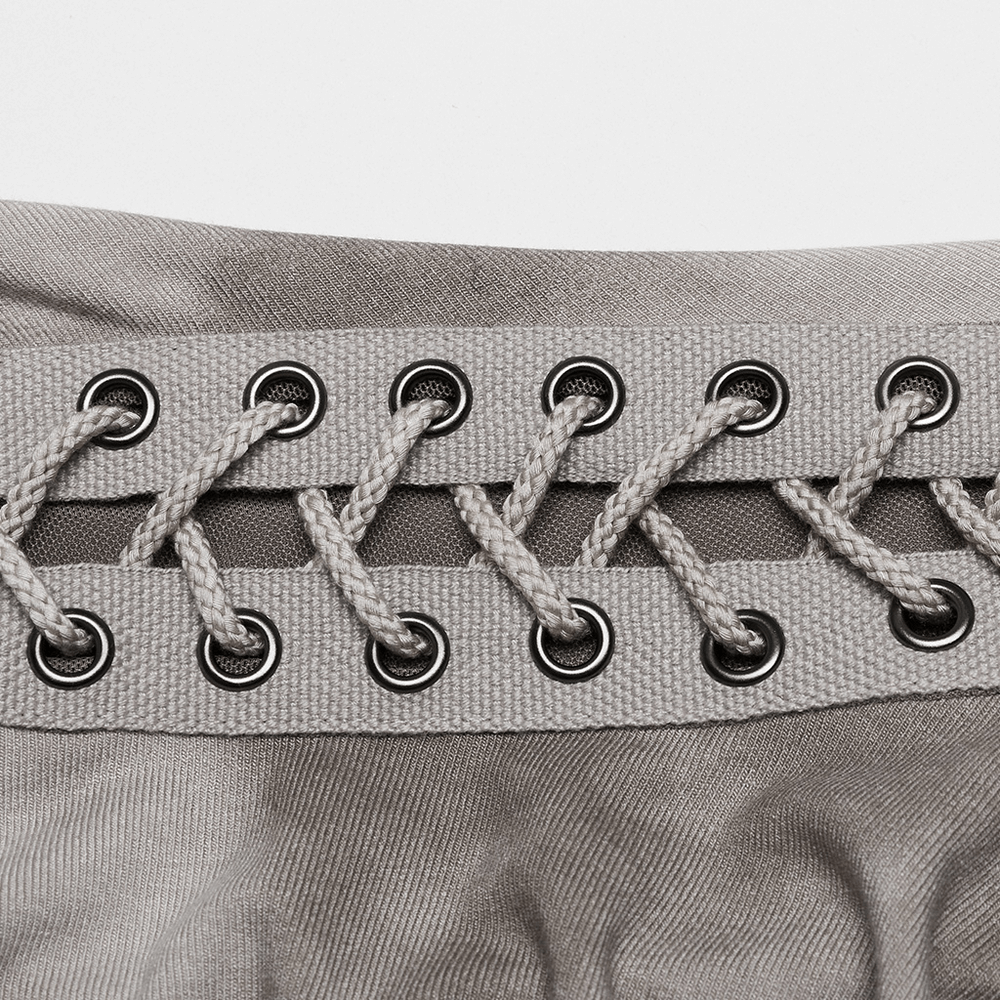 Close-up of eyelet detail and drawstring on a chic punk tie dye dress, showcasing edgy design elements.