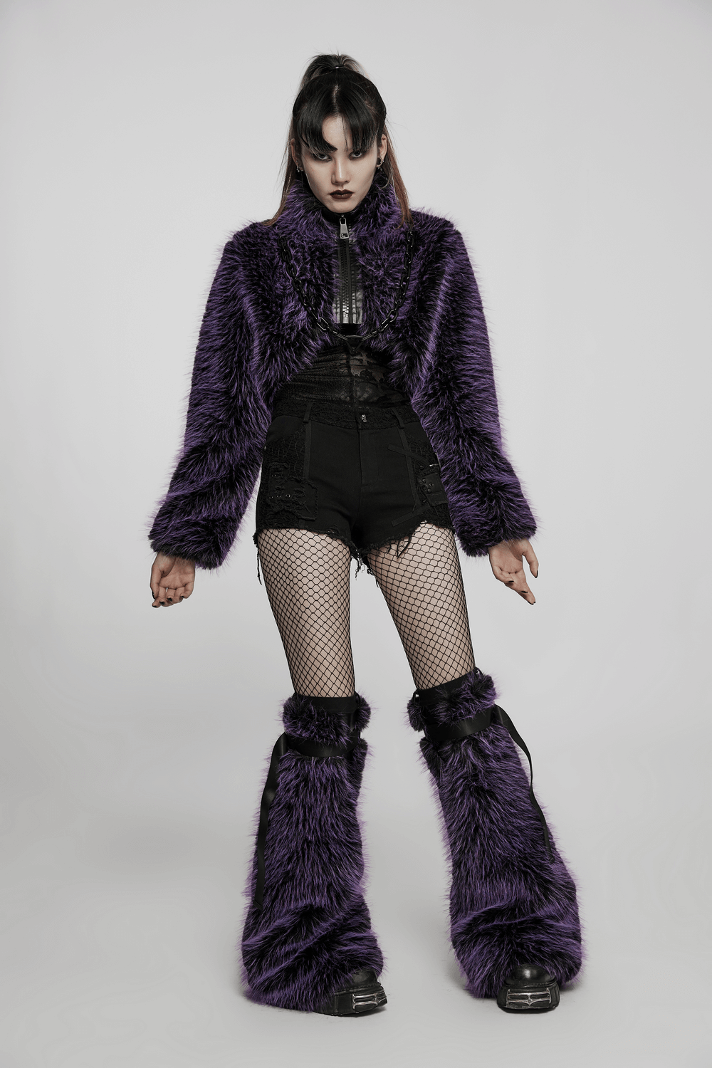 Chic purple shaggy crop jacket paired with black shorts and fishnet stockings, showcasing edgy streetwear style.