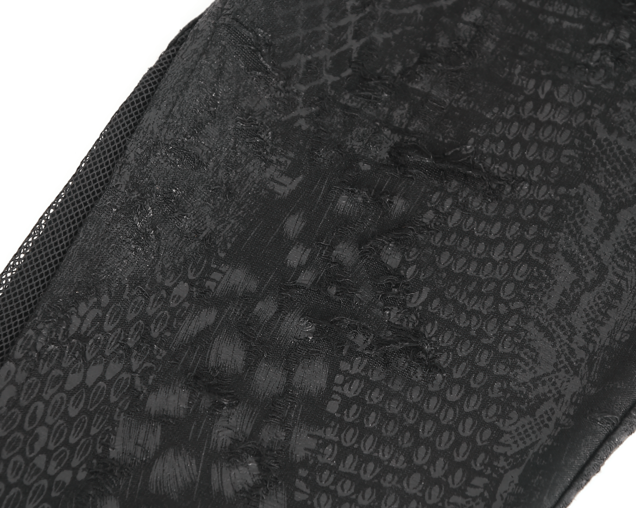 Close-up of chic black snake print leggings showcasing a textured reptile pattern for women.