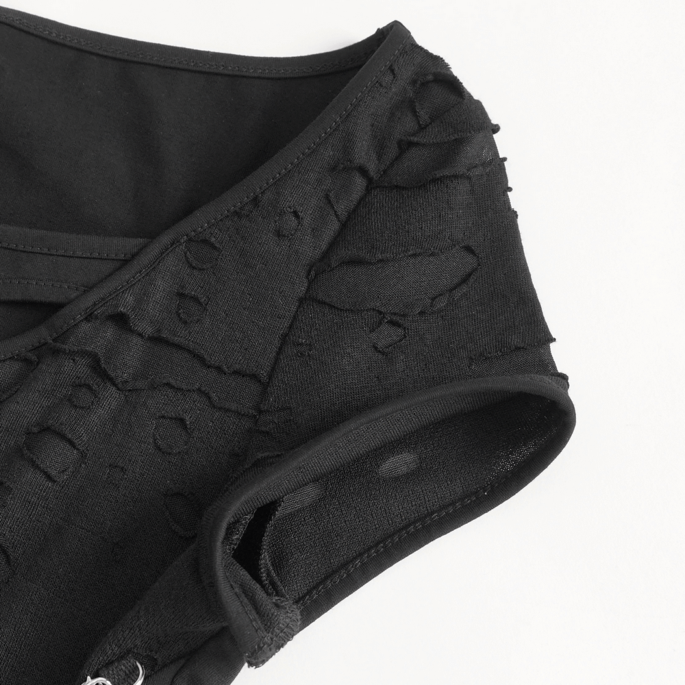 Chic black ripped T-shirt showcasing stylish chain accent and edgy design details, perfect for a trendy look.