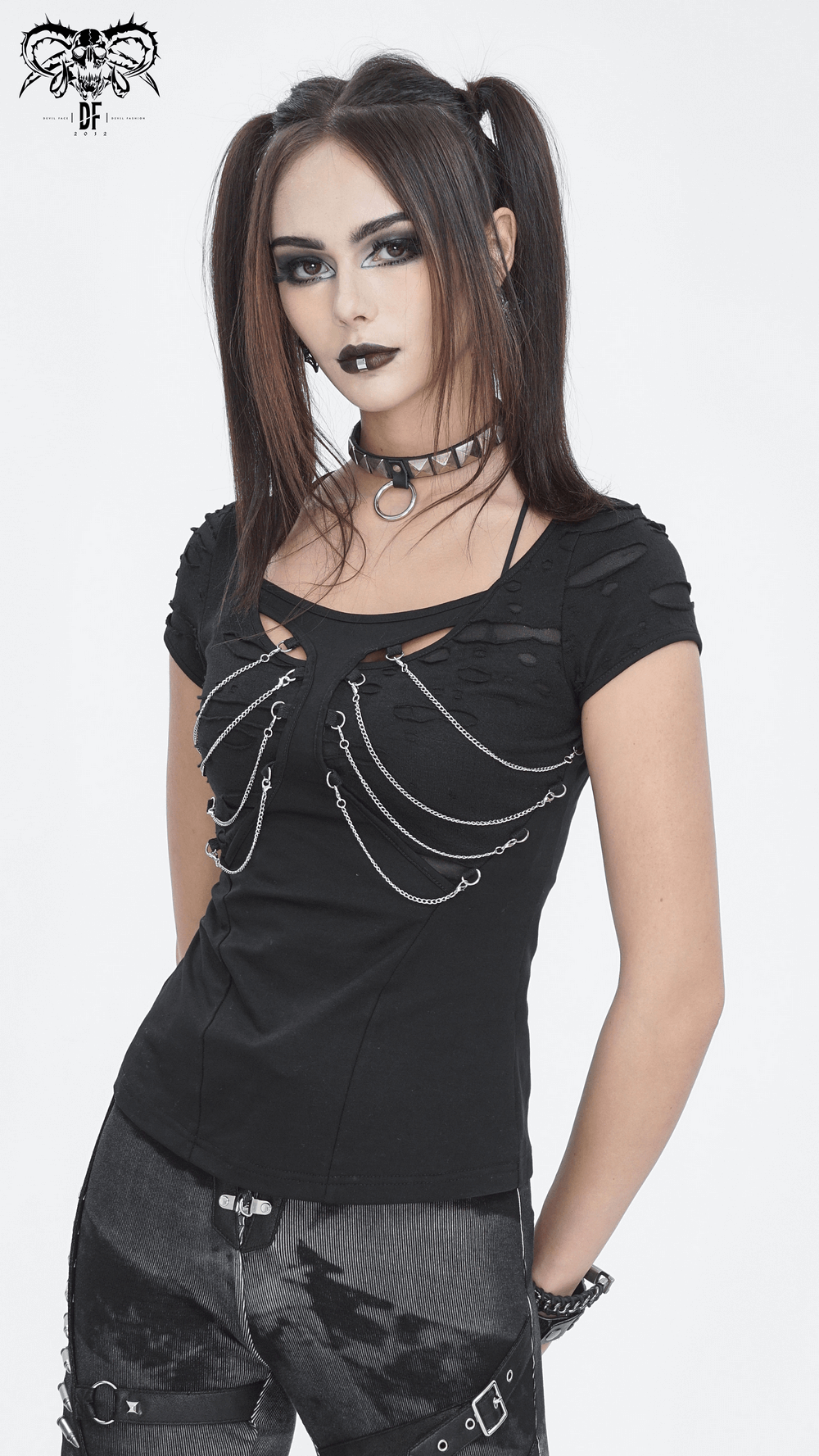Stylish black ripped t-shirt for women with chain accent, perfect for edgy outfits and night outs.