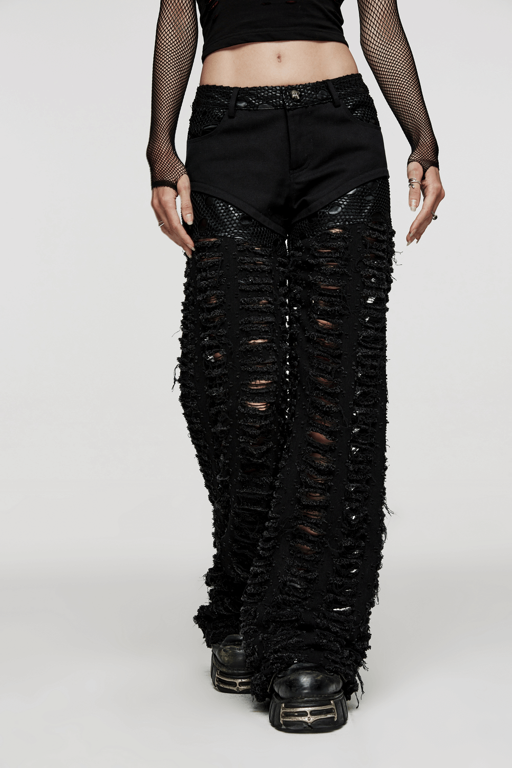 Chic gothic style ripped mesh trousers for women, featuring a dramatic silhouette and functional pockets.