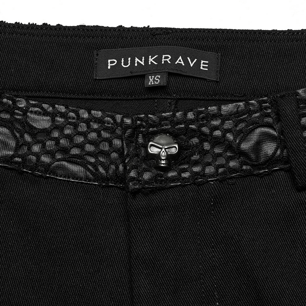 Close-up of Punkrave goth trousers featuring a mesh waistband and skull detail, ideal for chic gothic style.