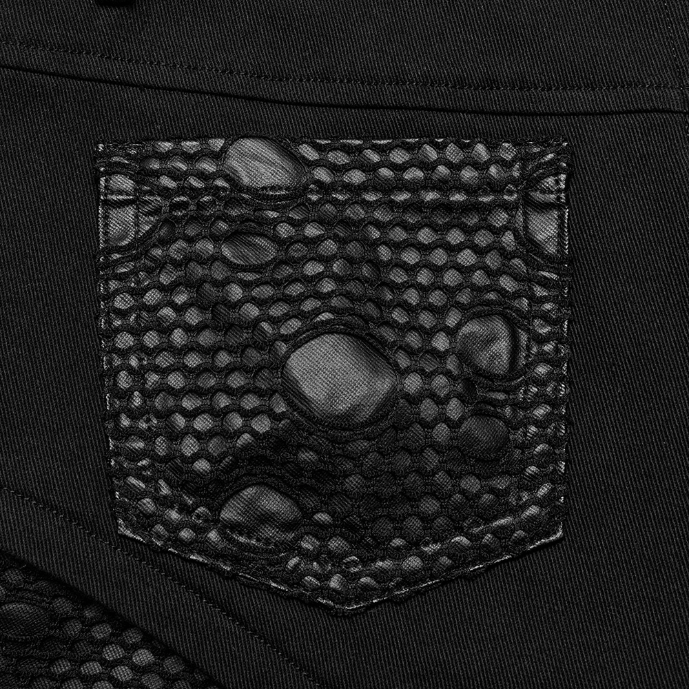 Close-up of black ripped mesh pocket design on chic gothic trousers for women.