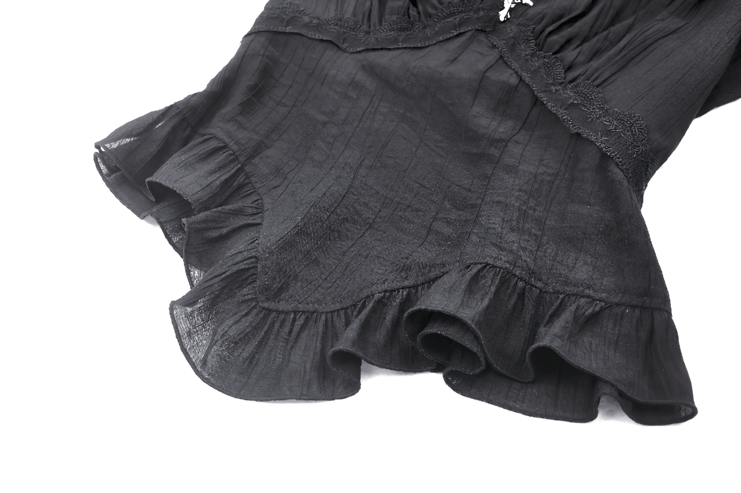 Close-up of chic black Gothic top with ruffled bell sleeves and lace detailing, featuring elegant flair and vintage-inspired charm.