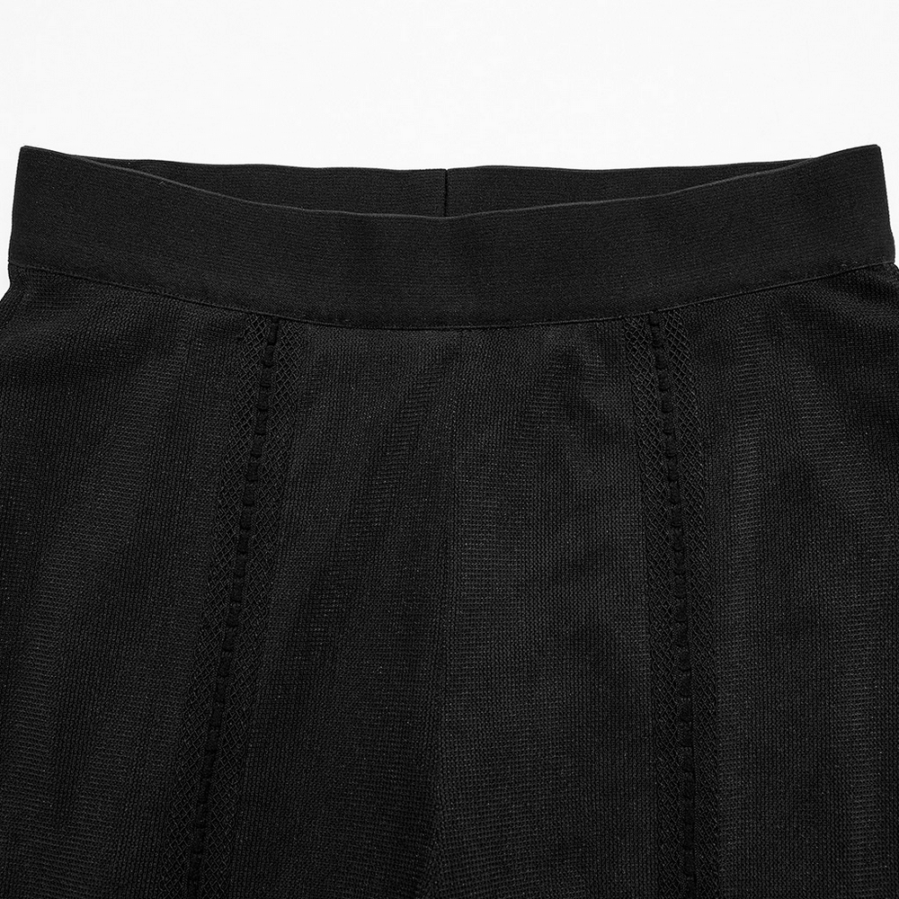 Close-up of the high elastic waistband of chic sheer flare pants with gothic lace detail.