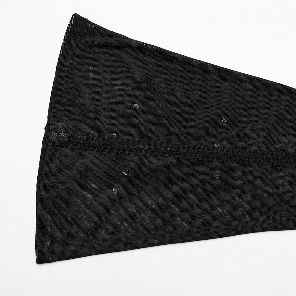 Black sheer fabric of flare pants featuring lace webbing and eyelets for a gothic aesthetic.