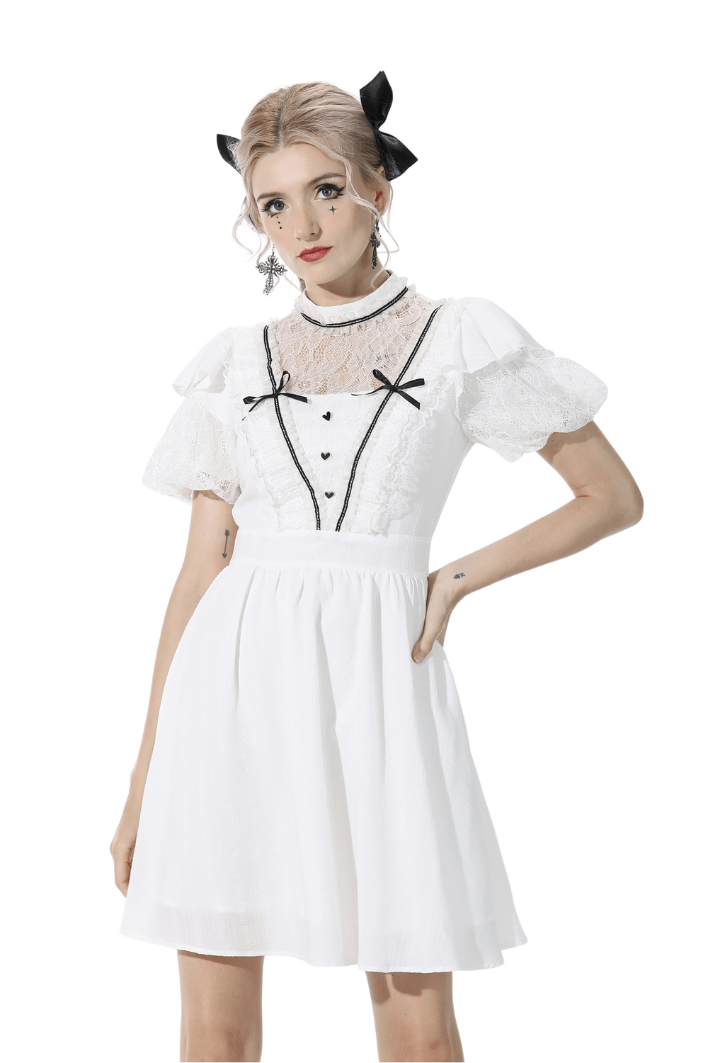 Chic short puff sleeve lace-trimmed white dress with black ribbon accents and an elegant A-line silhouette.