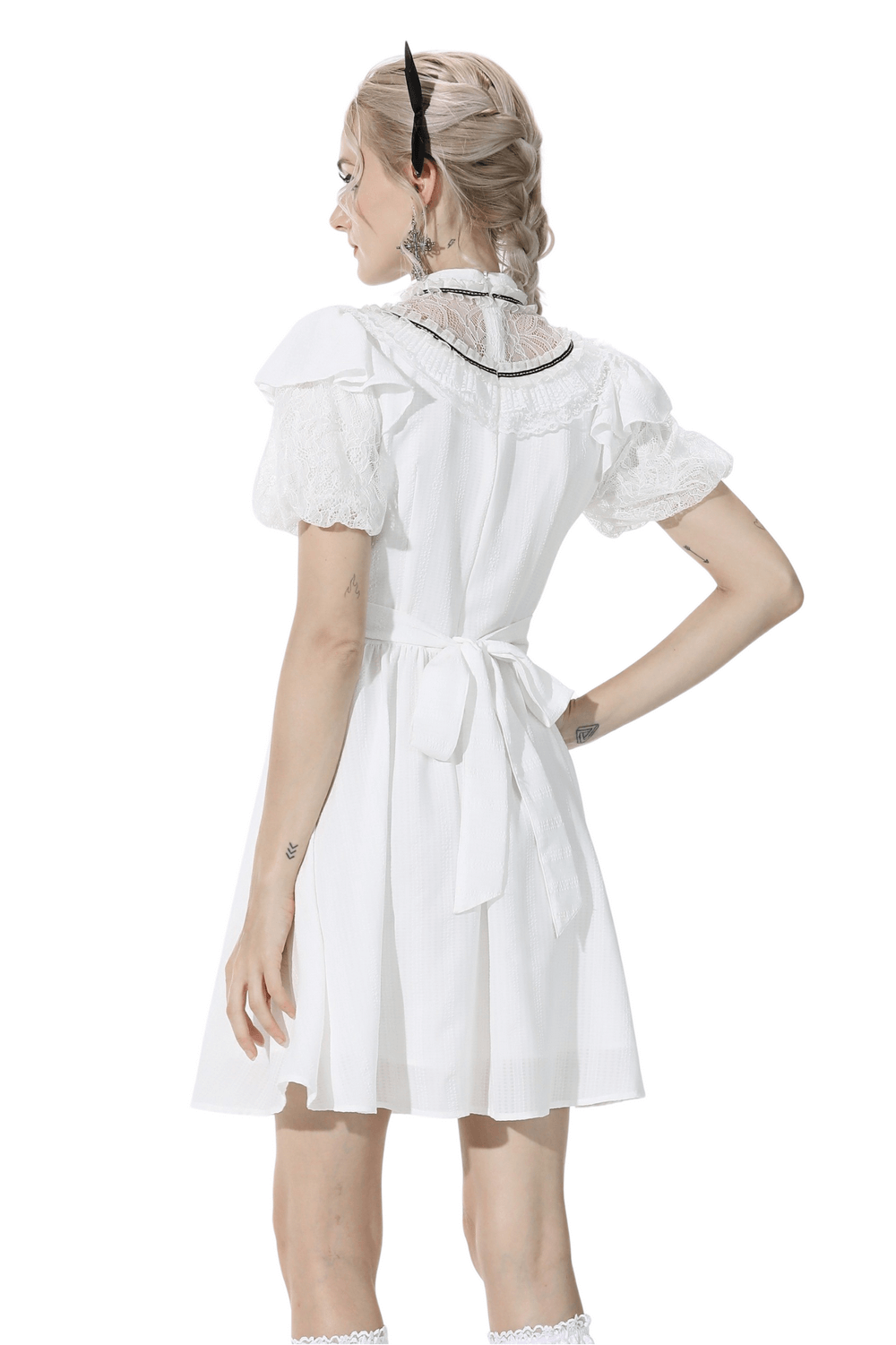 Chic white A-line dress with short puff sleeves and lace trim, featuring a ribbon tie at the back for a flattering silhouette.