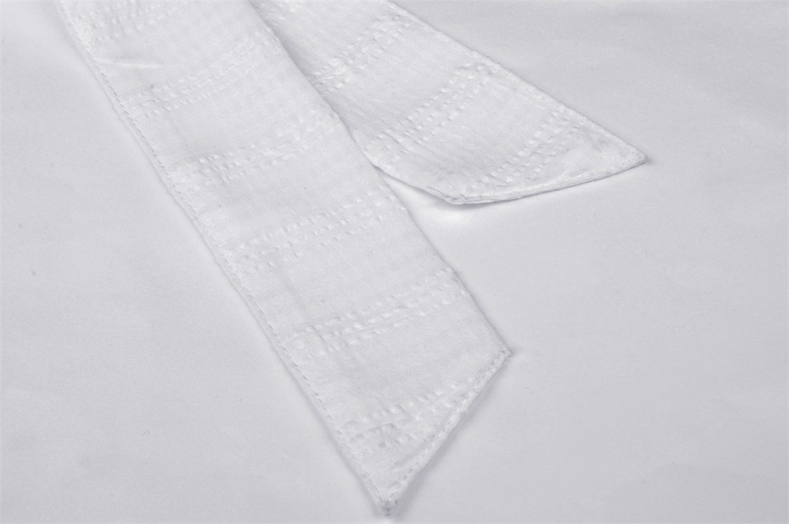 Elegant white ribbon accent featuring a delicate texture, perfect for enhancing dresses or stylish accessories.