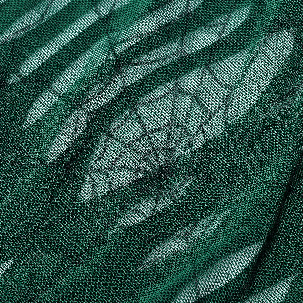 Close-up of stylish green spider mesh fabric, showcasing an edgy cut-out design perfect for chic daily wear.