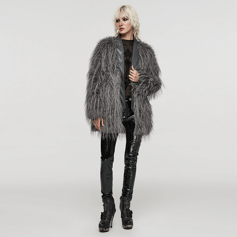 Chic staggered faux fur coat in grey with leather details, styled for effortless elegance and warmth.