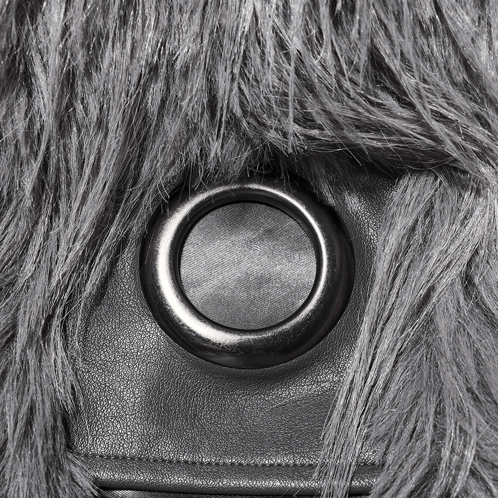 Close-up of staggered faux fur and textured leather detailing on a chic coat, showcasing stylish craftsmanship.
