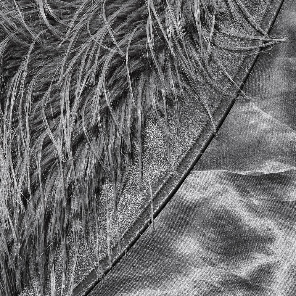 Close-up of chic staggered faux fur coat with leather detailing, highlighting luxurious textures and sophisticated design.