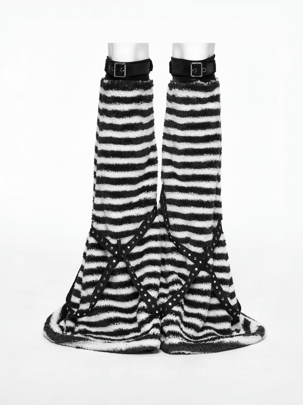 Chic striped plush leg warmers with cross straps in black and white, perfect for cozy, stylish winter outfits.