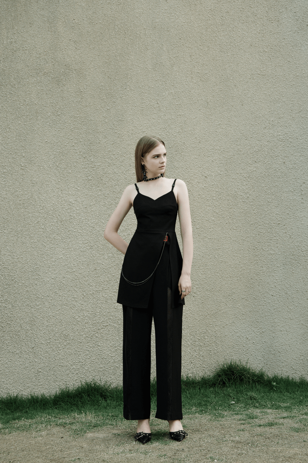 Chic v-neck slip dress with chain accent, high slit, and flattering silhouette, perfect for stylish occasions.