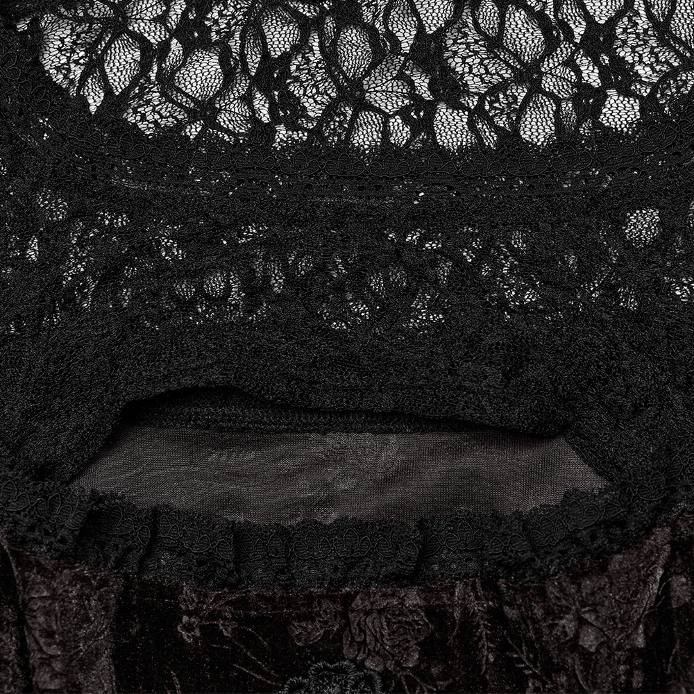 Close-up of the intricate lace and velvet details on a goth velvet dress with mesh patchwork.
