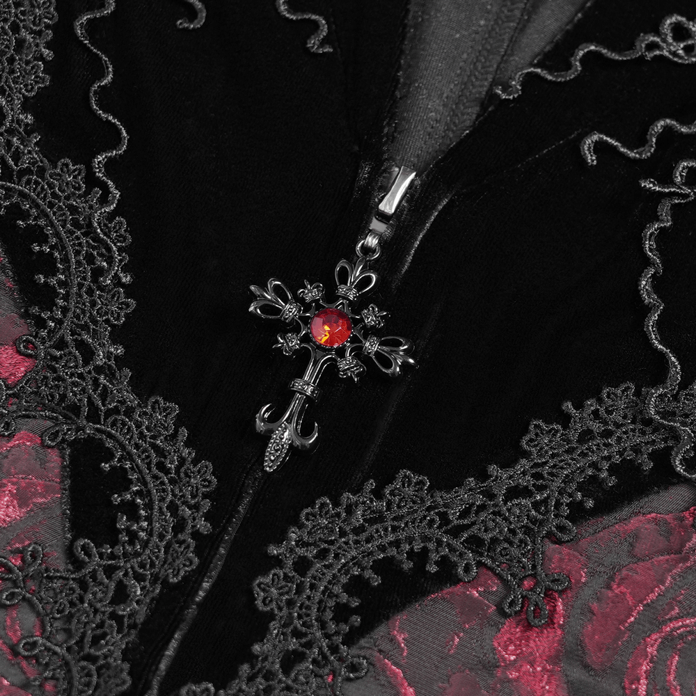 Close-up of gothic velvet dress with lace detailing and a ruby cross zipper charm.