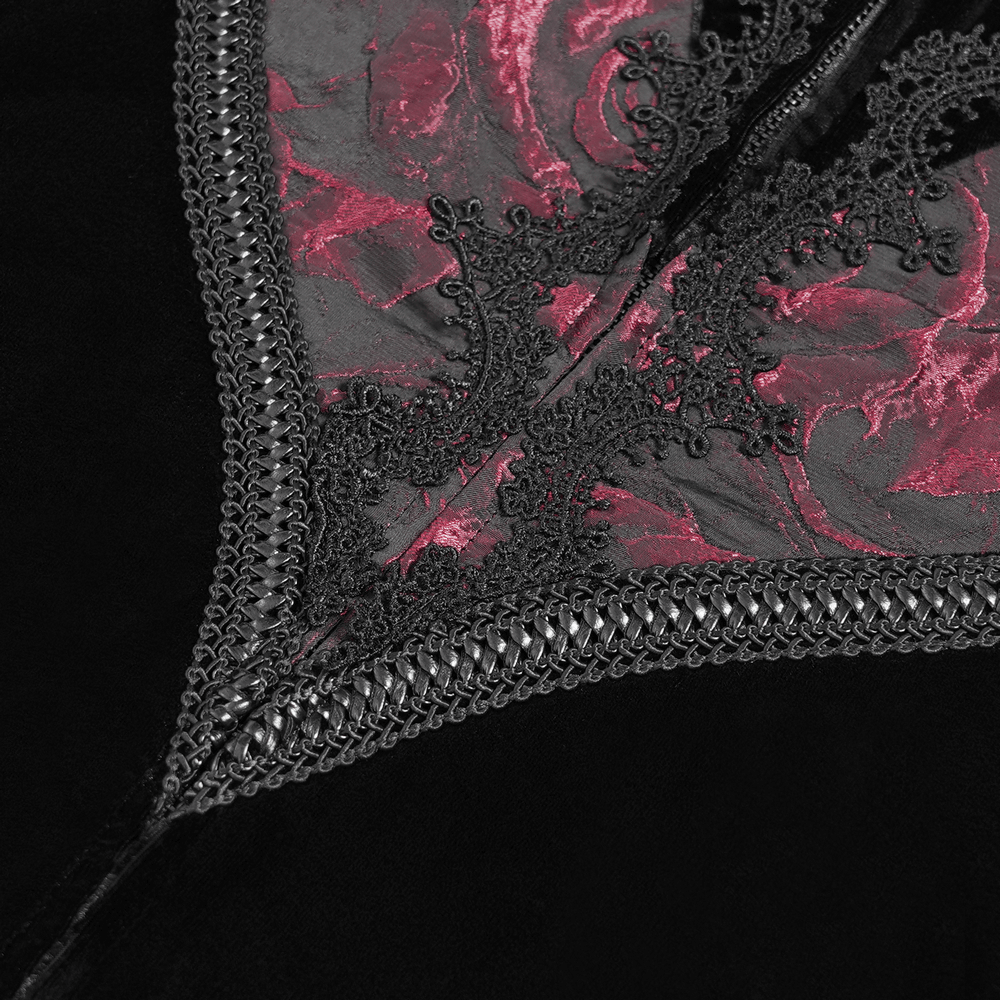 Close-up of gothic velvet evening dress with intricate black lace and wine red brocade detailing.