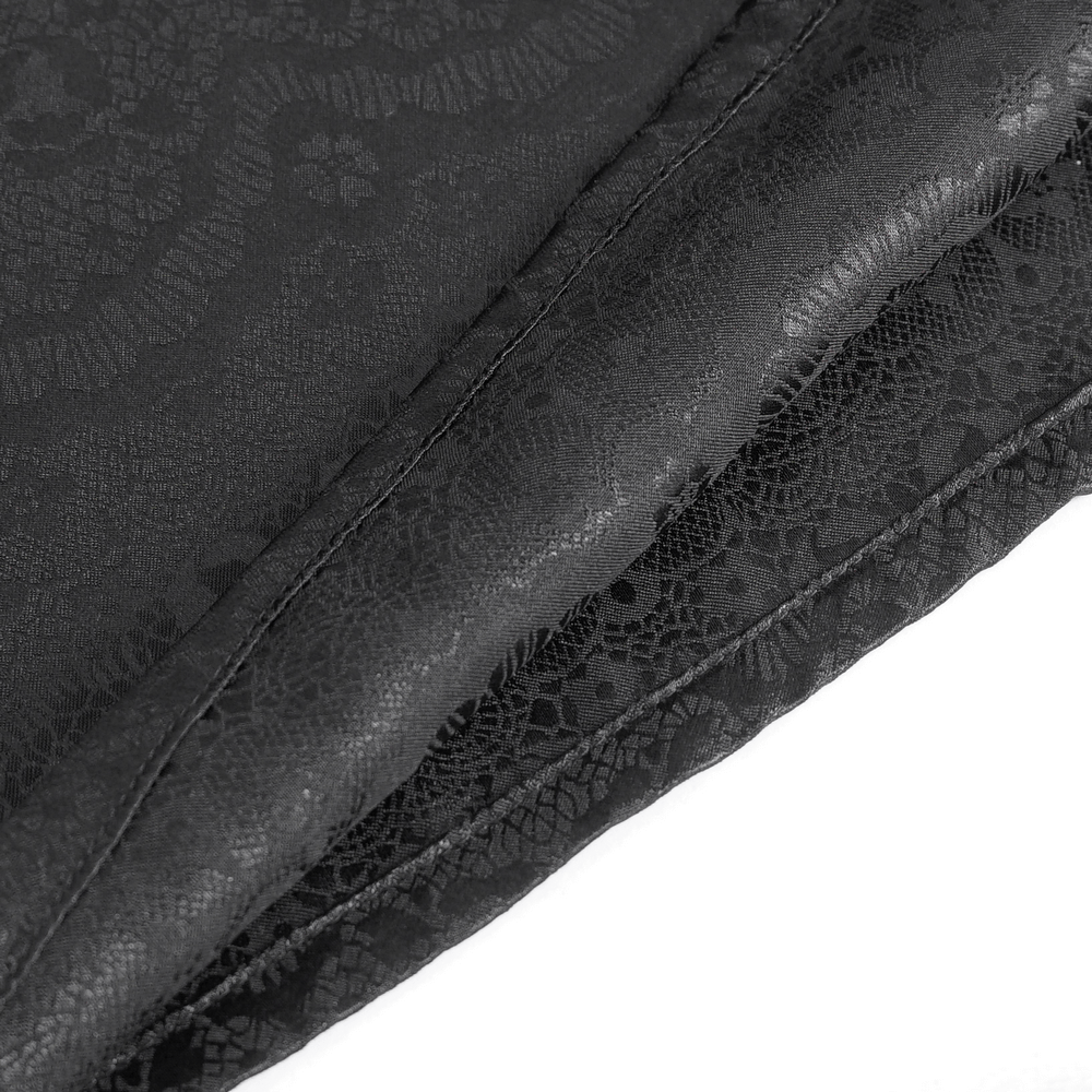 Close-up of elegant black lace fabric showcasing intricate patterns and textures for a chic Victorian style.