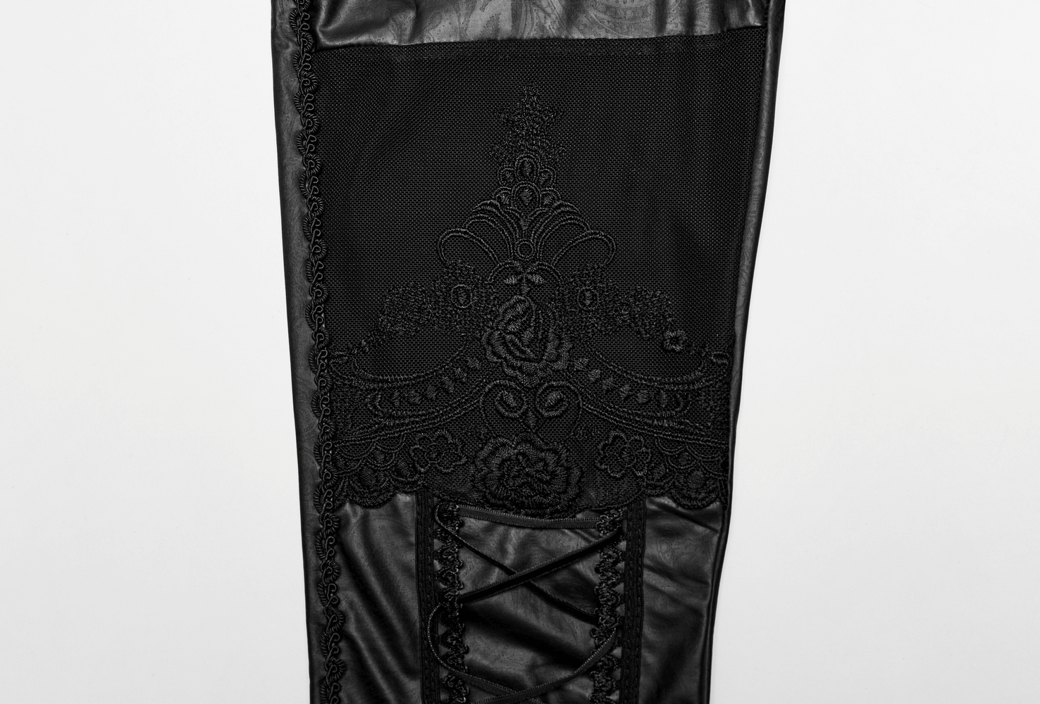 Chic black leggings with delicate lace detailing and lace-up design, perfect for modern fashionistas.