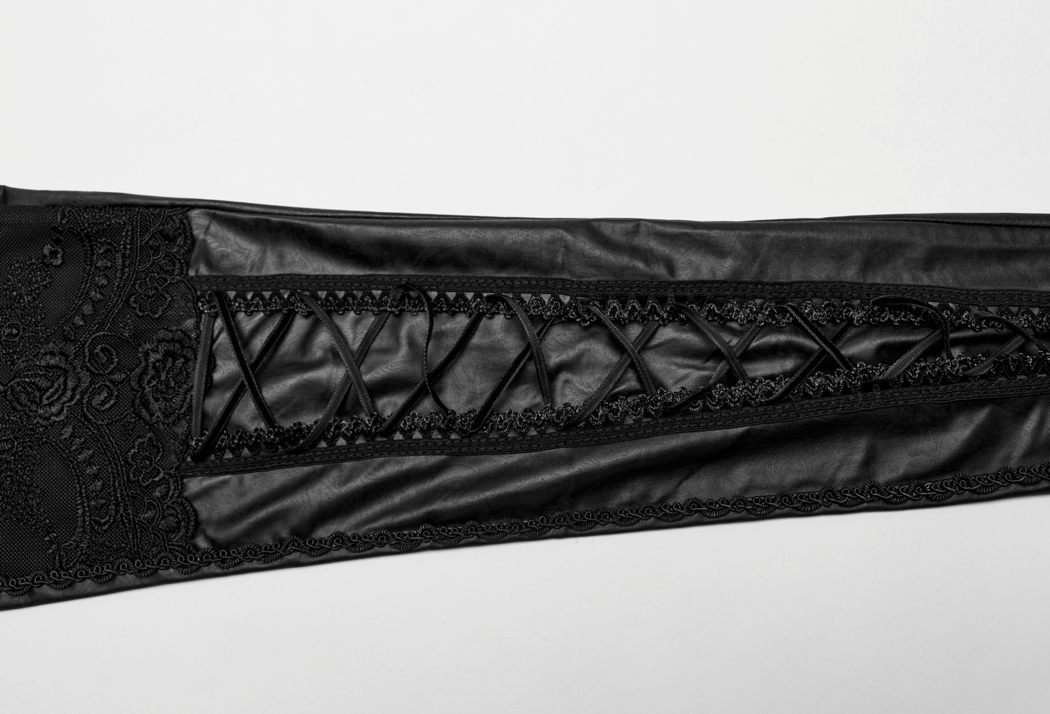 Chic black flocking leggings featuring lace details and lace-up design, perfect for stylish women.