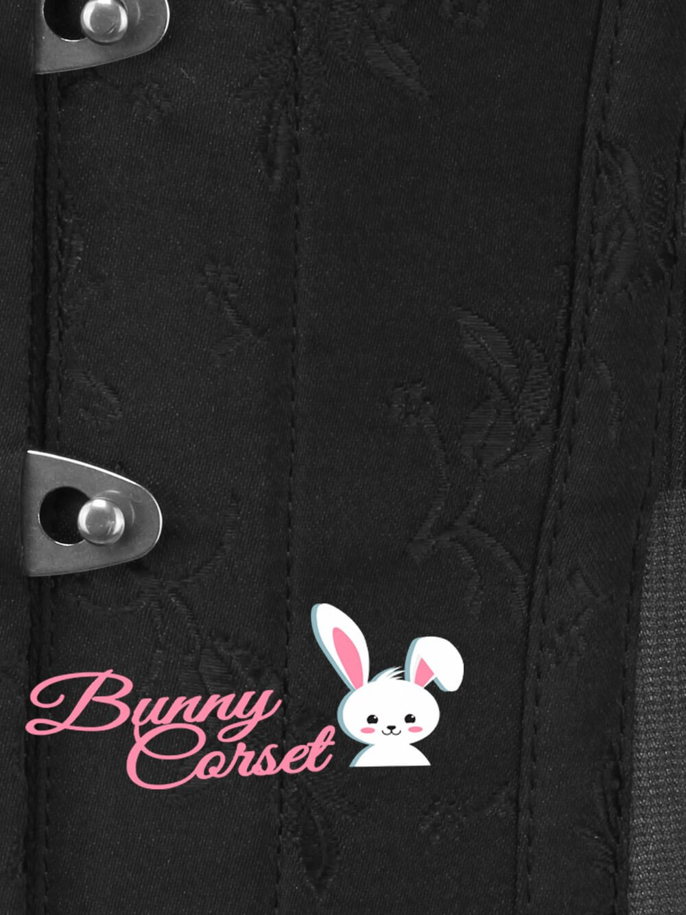 Close-up of Bunny Corset with black brocade design and metal busk, featuring a cute bunny logo.