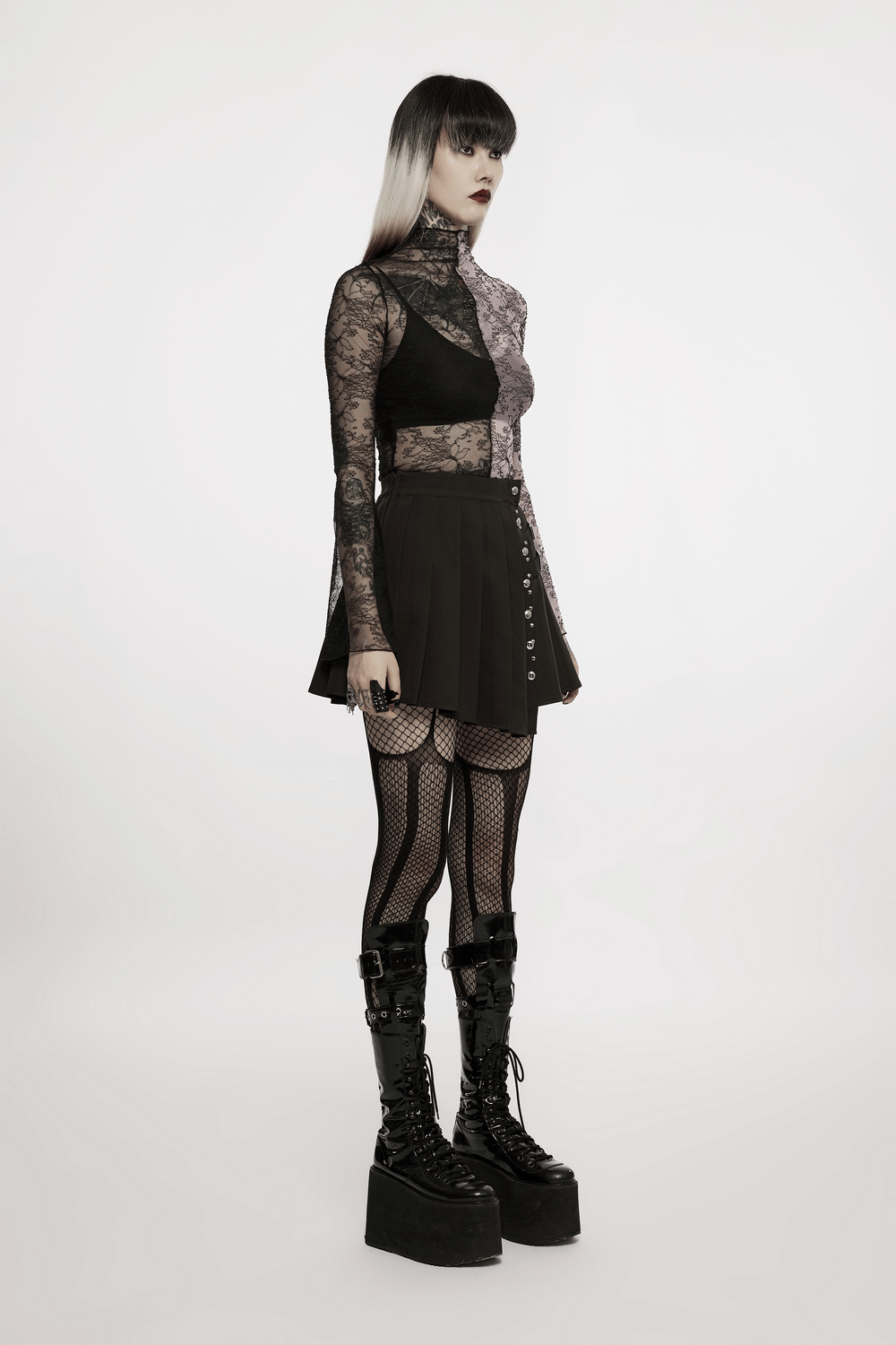 Chic woman in punk style, wearing a pleated mini skirt with rivets, net tights, and statement platform boots.