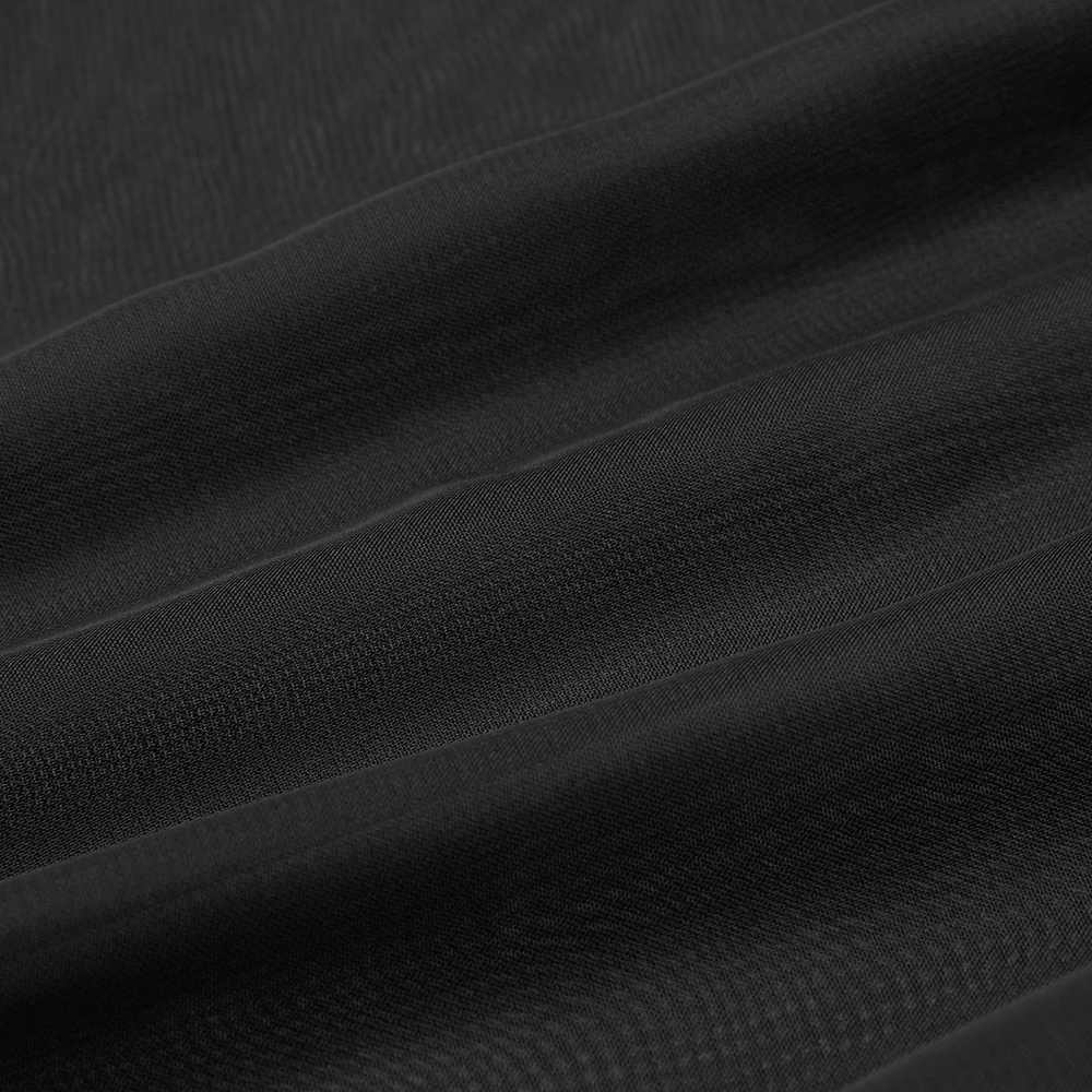 Close-up view of soft black chiffon fabric, showcasing its sheer and delicate texture for fashion designs.