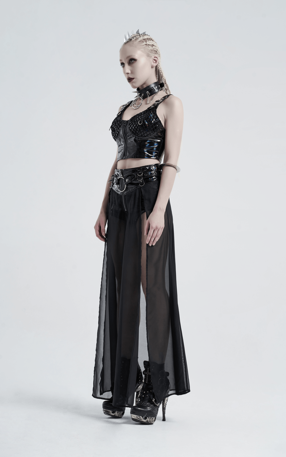Model wearing a chiffon overlaid punk half skirt with adjustable belt, showcasing a bold and edgy style.