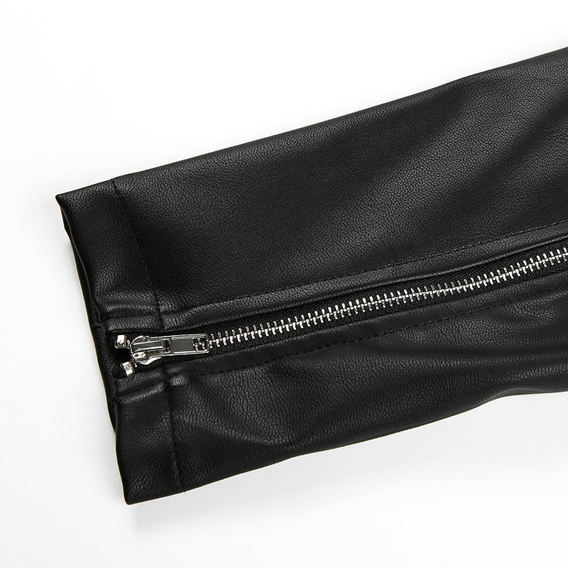 Close-up of black faux leather motorcycle jacket sleeve with zipper detail for women.