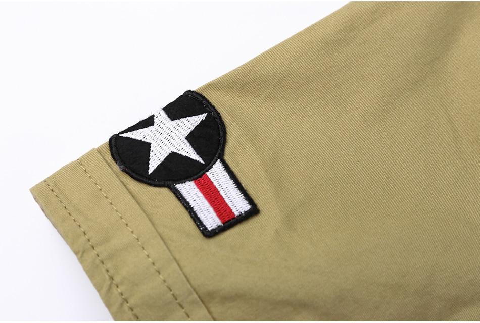 Close-up of a military-style patch featuring a star and stripes on a cotton shirt sleeve.
